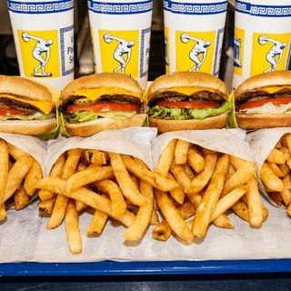 Classic Family Pack — 4 Combos — 4 burgers; 4 chosen sides; 4 chosen drinks; each burger: 1 quarter-pound patty + 1 cheese slice